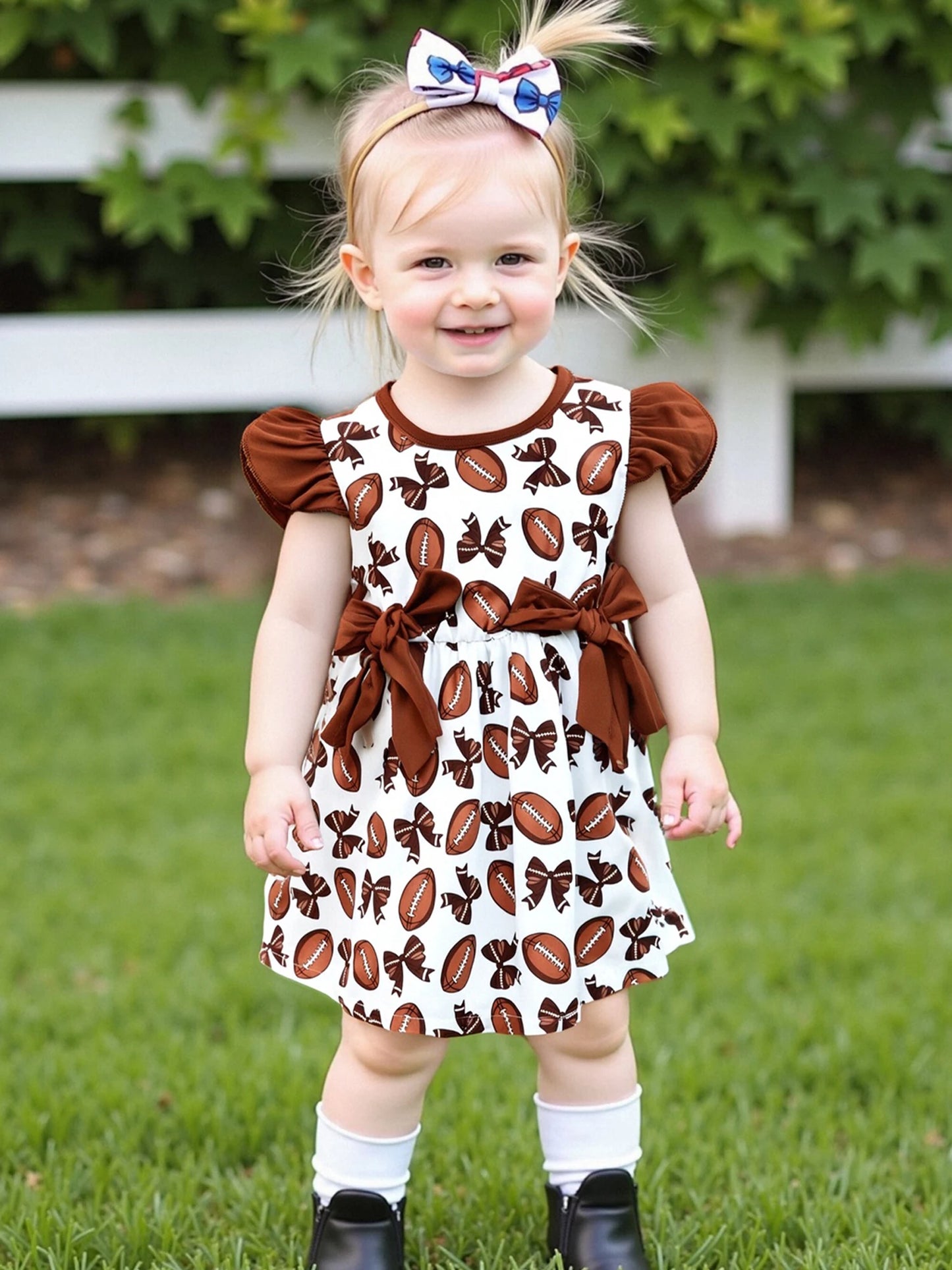 Girls Summer A-line Dress with Flutter Sleeves and Round Neckline featuring Rugby Print Design and Bow Embellishment