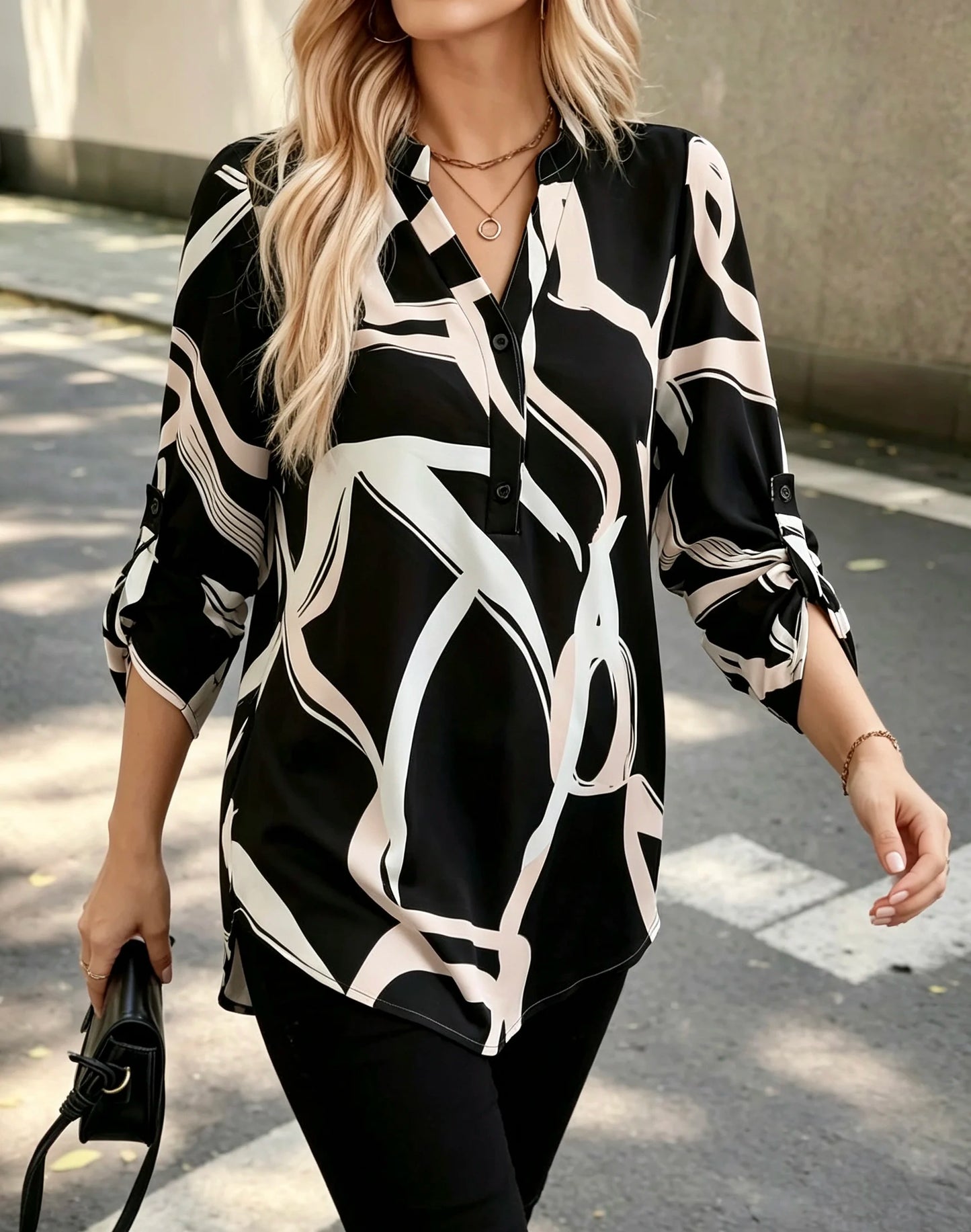 Plus size women's black and white abstract line half-open shirt; stand collar half-buttoned with roll-up three-quarter sleeves and pockets; drape-effect commuting printed top