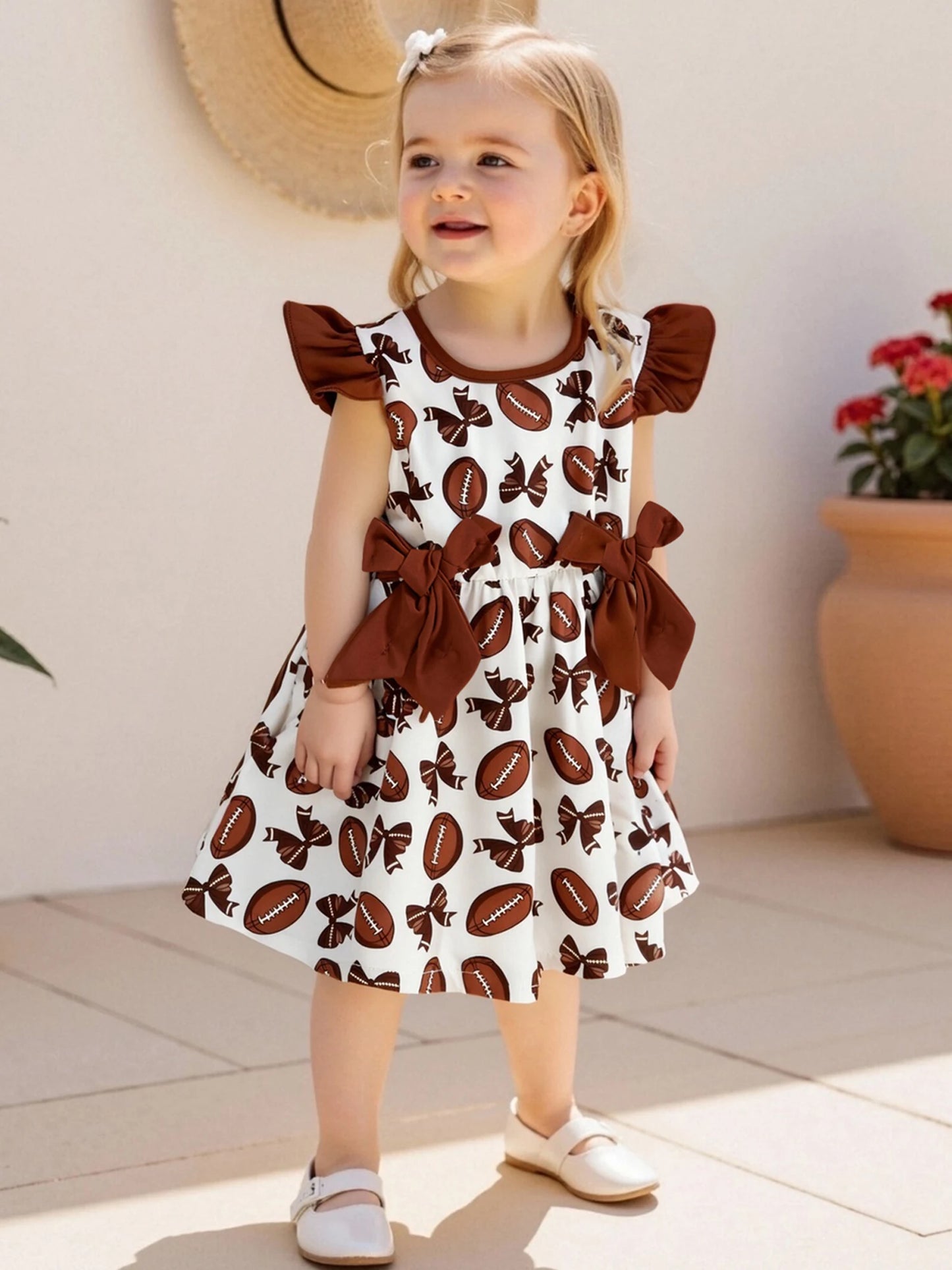 Girls Summer A-line Dress with Flutter Sleeves and Round Neckline featuring Rugby Print Design and Bow Embellishment