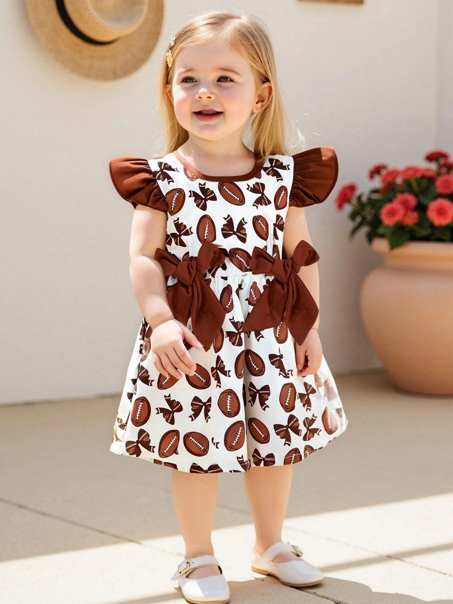 Girls Summer A-line Dress with Flutter Sleeves and Round Neckline featuring Rugby Print Design and Bow Embellishment
