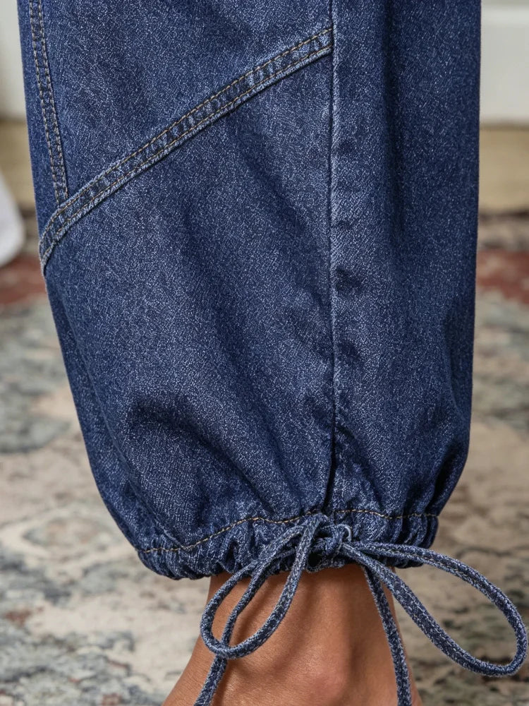 2026 new style women's work pants, soft washed high-waist stitched drawstring denim fabric, geometric stitching design, ankle tie cuffs, plus size available, warehouse delivery, fast shipping. Retro western bohemian style, su