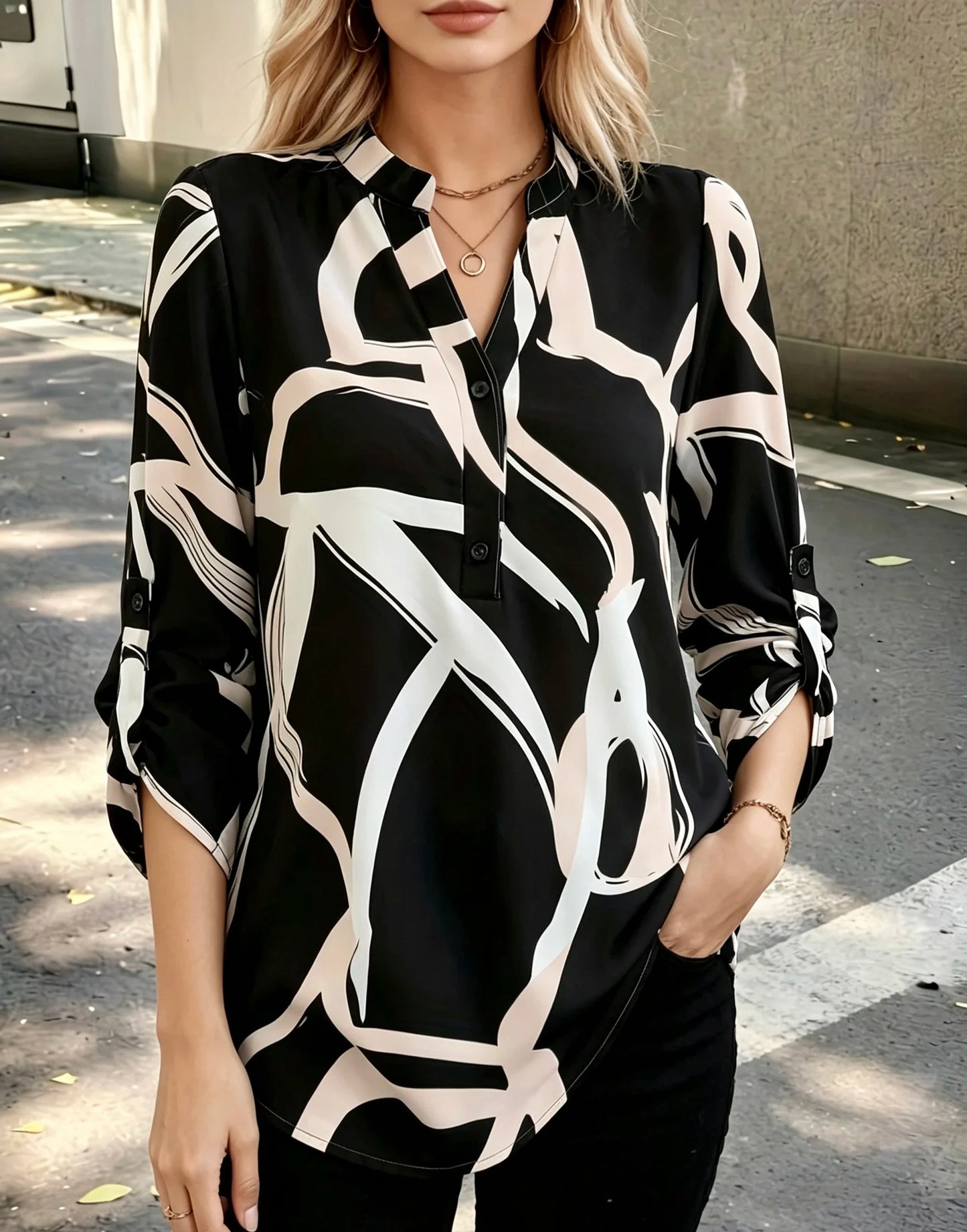 Plus size women's black and white abstract line half-open shirt; stand collar half-buttoned with roll-up three-quarter sleeves and pockets; drape-effect commuting printed top