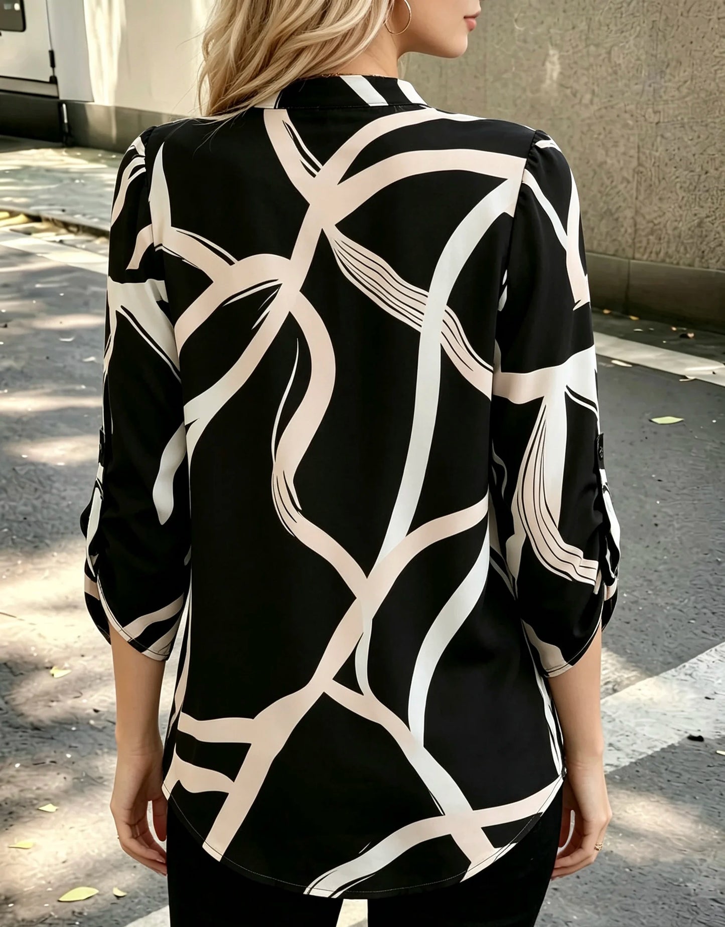 Plus size women's black and white abstract line half-open shirt; stand collar half-buttoned with roll-up three-quarter sleeves and pockets; drape-effect commuting printed top